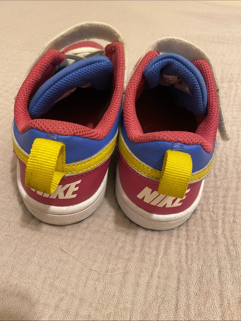 Nike Kids Low-Top Sneakers in White, Blue, Pink & Yellow. Size 13.5